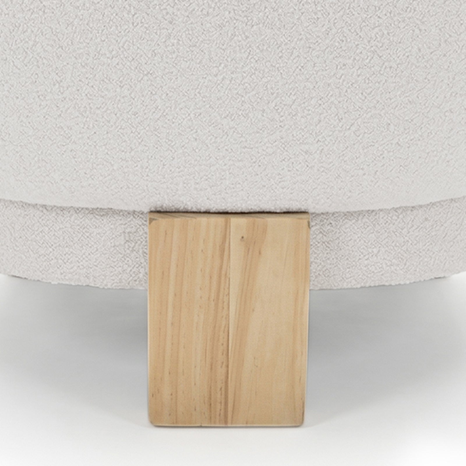 Close-up of the Sornel Boucle Upholstered Accent Chair in Cream White, showcasing its textured bouclé fabric and sturdy block-style wooden leg, highlighting its elegant design and craftsmanship.