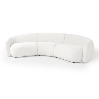 Modern crescent-shaped white sofa on white background