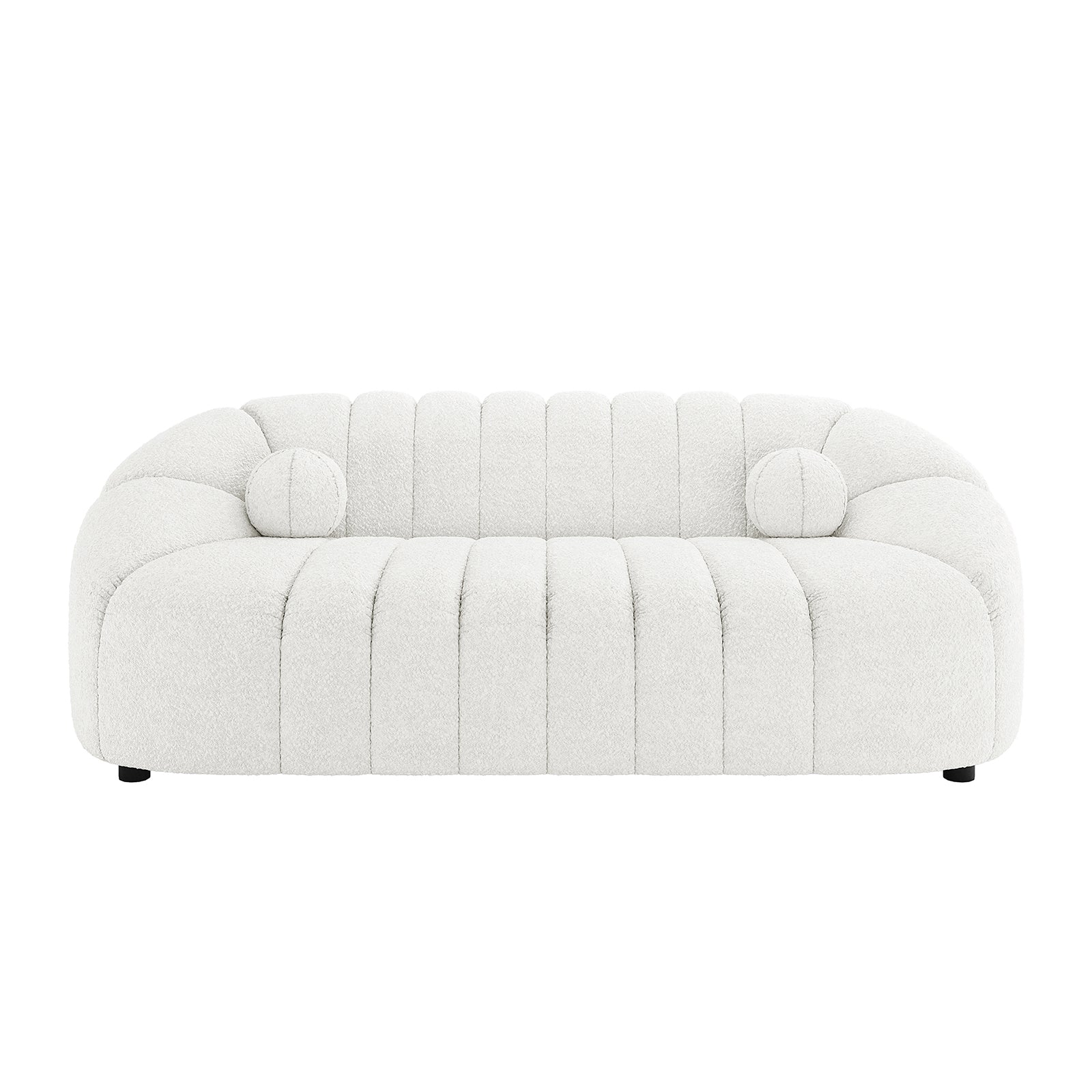 Trina 3 Seater Boucle Sofa with Pillows in Cream White features a modern design with curved arms, vertical channel tufting, and includes matching round bolster pillows, all on discreet black feet.