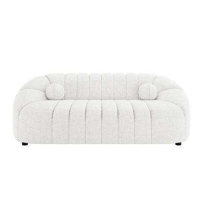 Trina 6 Seater Boucle Sofa Set with Pillows in Cream White, featuring low-slung design, deep vertical channel tufting, rounded arms, and matching round bolster pillows, upholstered in textured bouclé fabric.