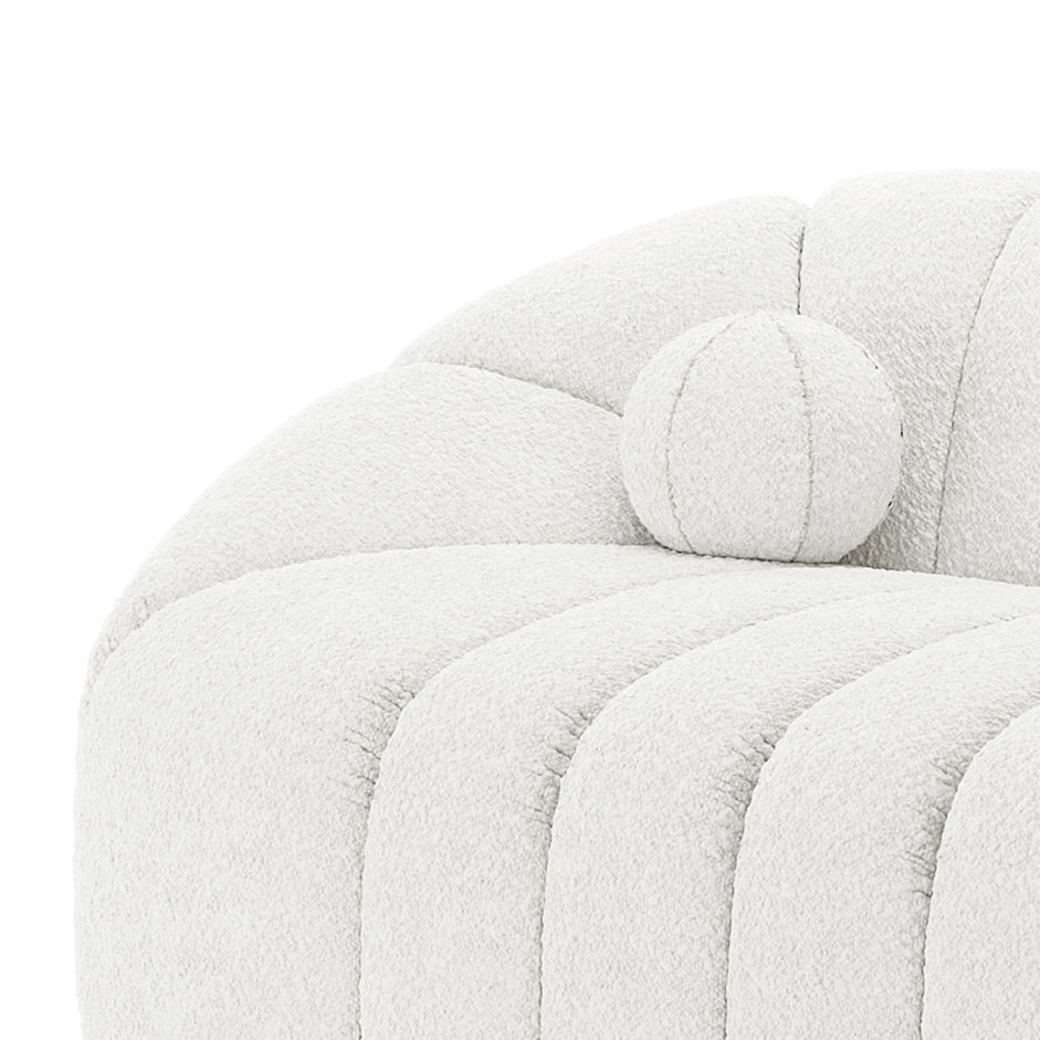 Close-up of the Trina 6 Seater Boucle Sofa Set with Pillows in Cream White, showcasing plush, off-white bouclé upholstery, deep channel tufting, and a matching round bolster pillow for added elegance.