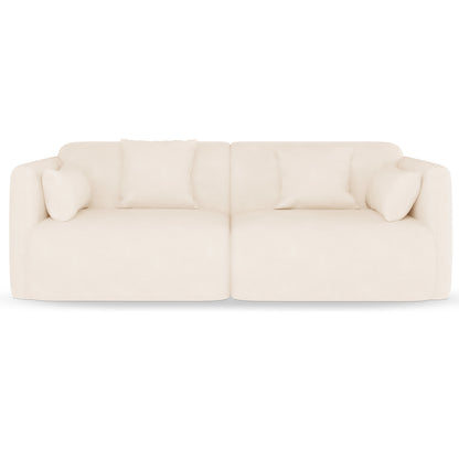 Vestalia 4 Seater Velvet Sofa Set in Cream White, featuring two-seat modules with low arms, five matching throw pillows, and a minimalist, Scandinavian-inspired design in soft velvet fabric.