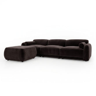 Dark brown sectional sofa with matching ottoman on white background