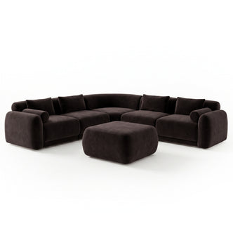 Modern dark-colored curved sectional sofa with matching ottoman on white background