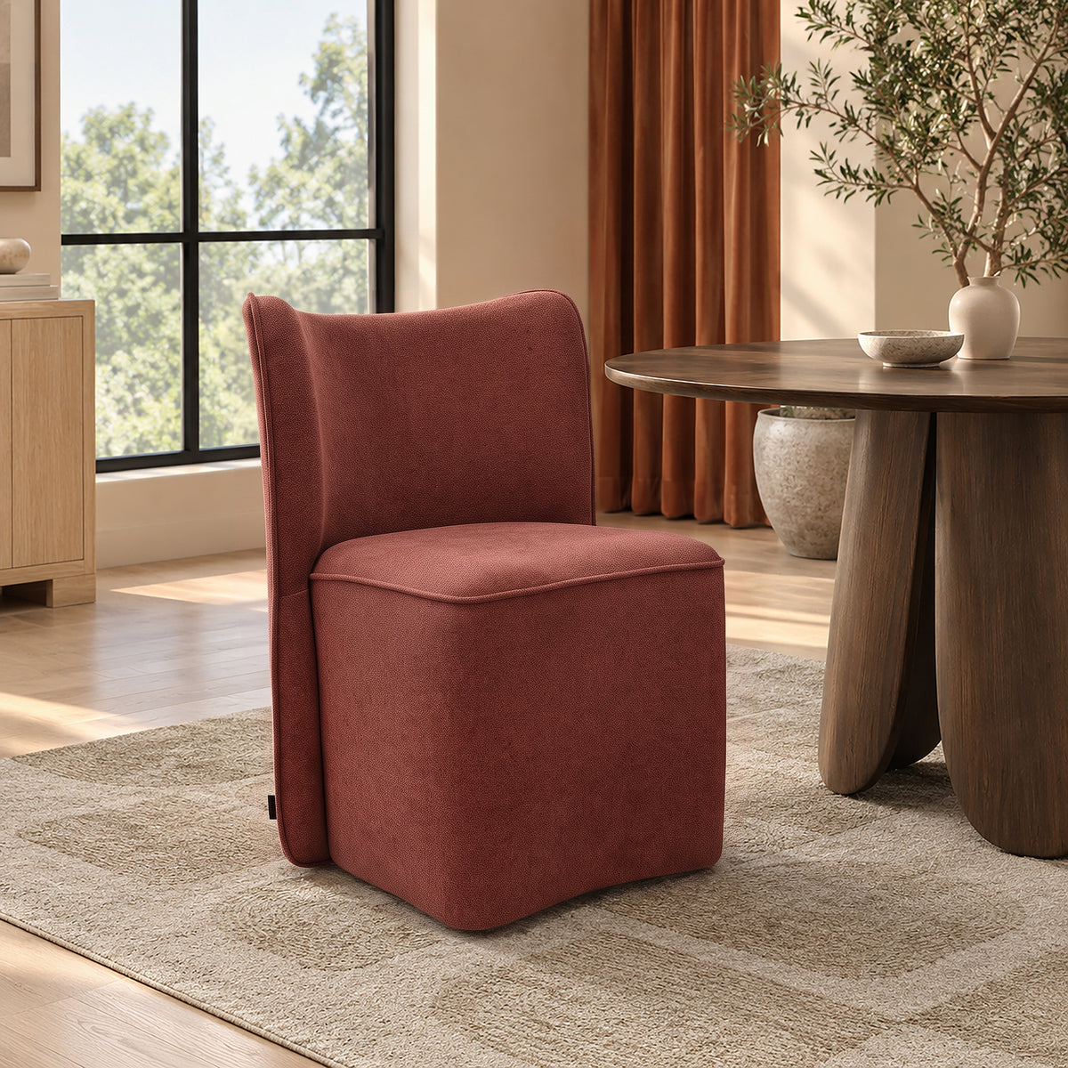 Rust-colored upholstered chair in a warm room setting