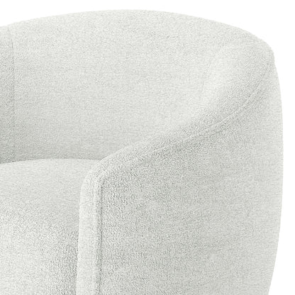 Yara Bouclé Accent Chair in Cream White, featuring a softly rounded back and arms, upholstered in textured bouclé fabric. The design reflects a modern twist on 70’s retro style.