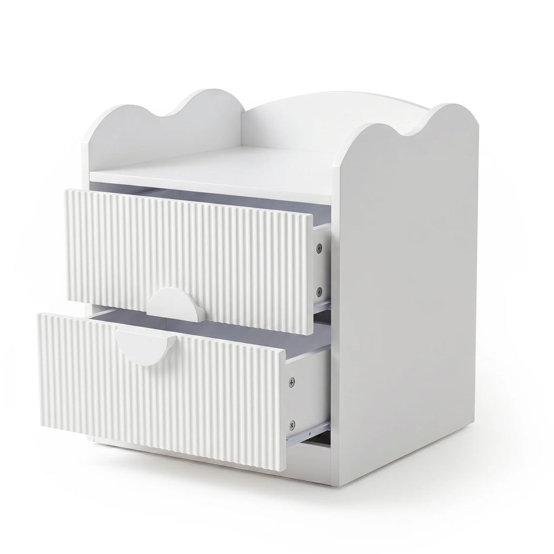 A white bedside table with a scalloped-edge top and two drawers featuring fluted fronts and semi-circular handles.