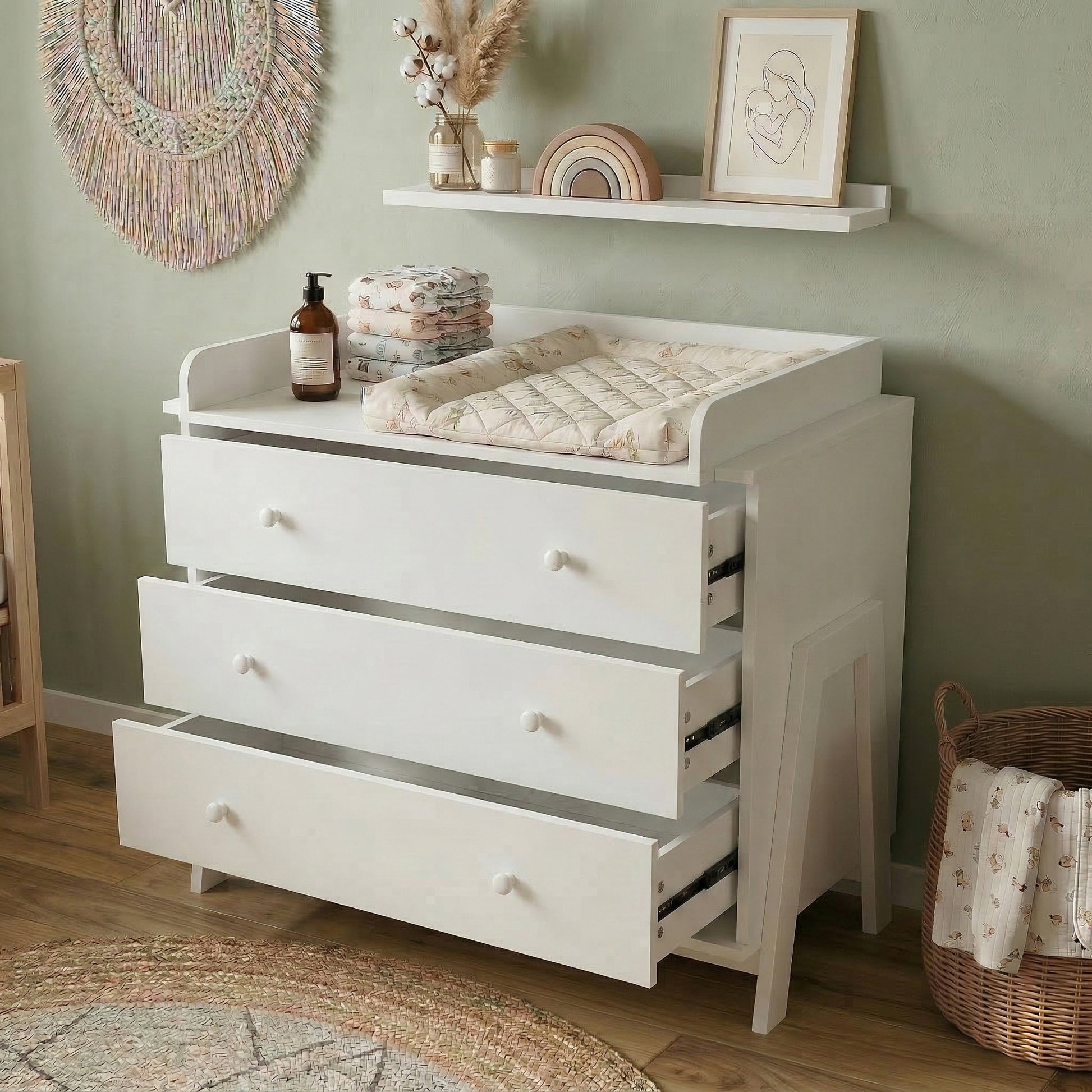 White changing table dresser in nursery with drawers slightly open