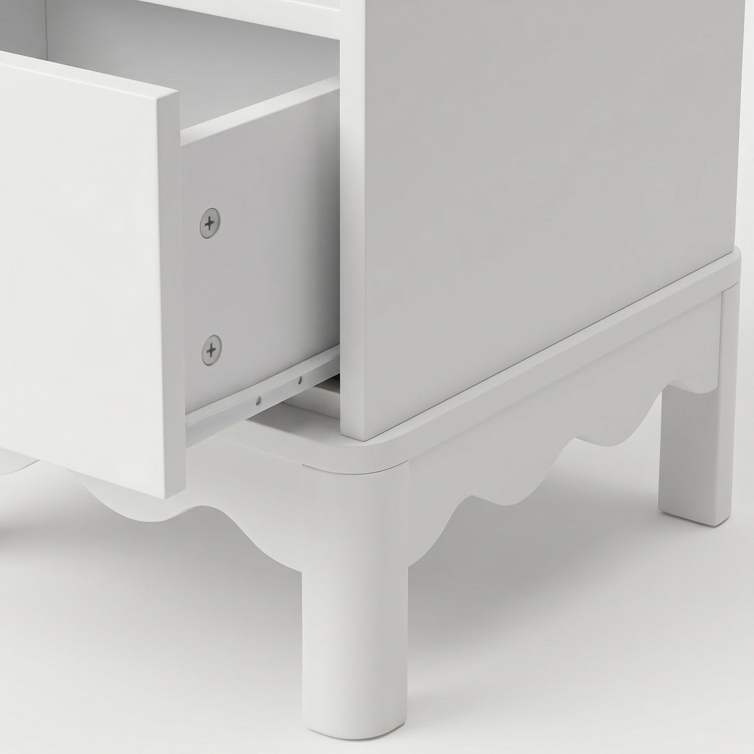 Close-up of nightstand side and open drawer on white background