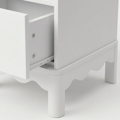 Close-up of nightstand side and open drawer on white background