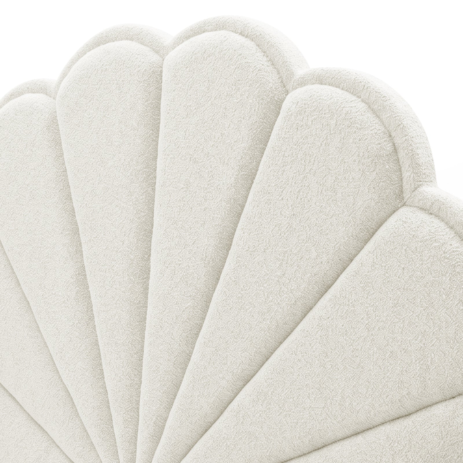 Close-up of the scalloped upholstered headboard section on white background