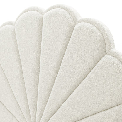 Close-up of the scalloped upholstered headboard section on white background