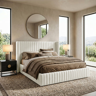 Cream upholstered bed in styled bedroom setting