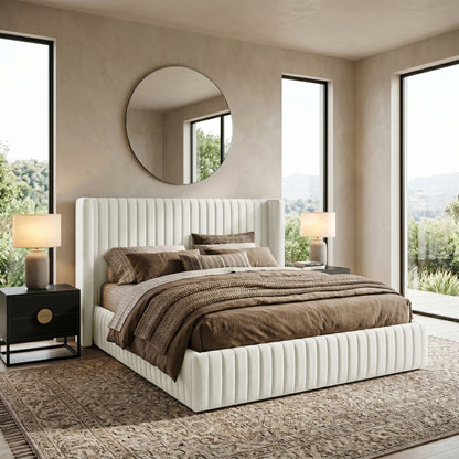 Cream upholstered bed in styled bedroom setting