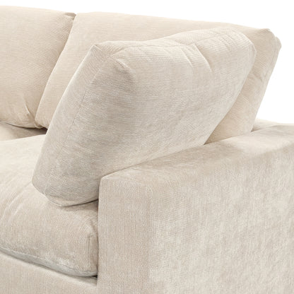 Close-up of beige sofa armrest and cushions on a white background