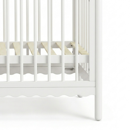 Close-up of crib slats and legs on a white background