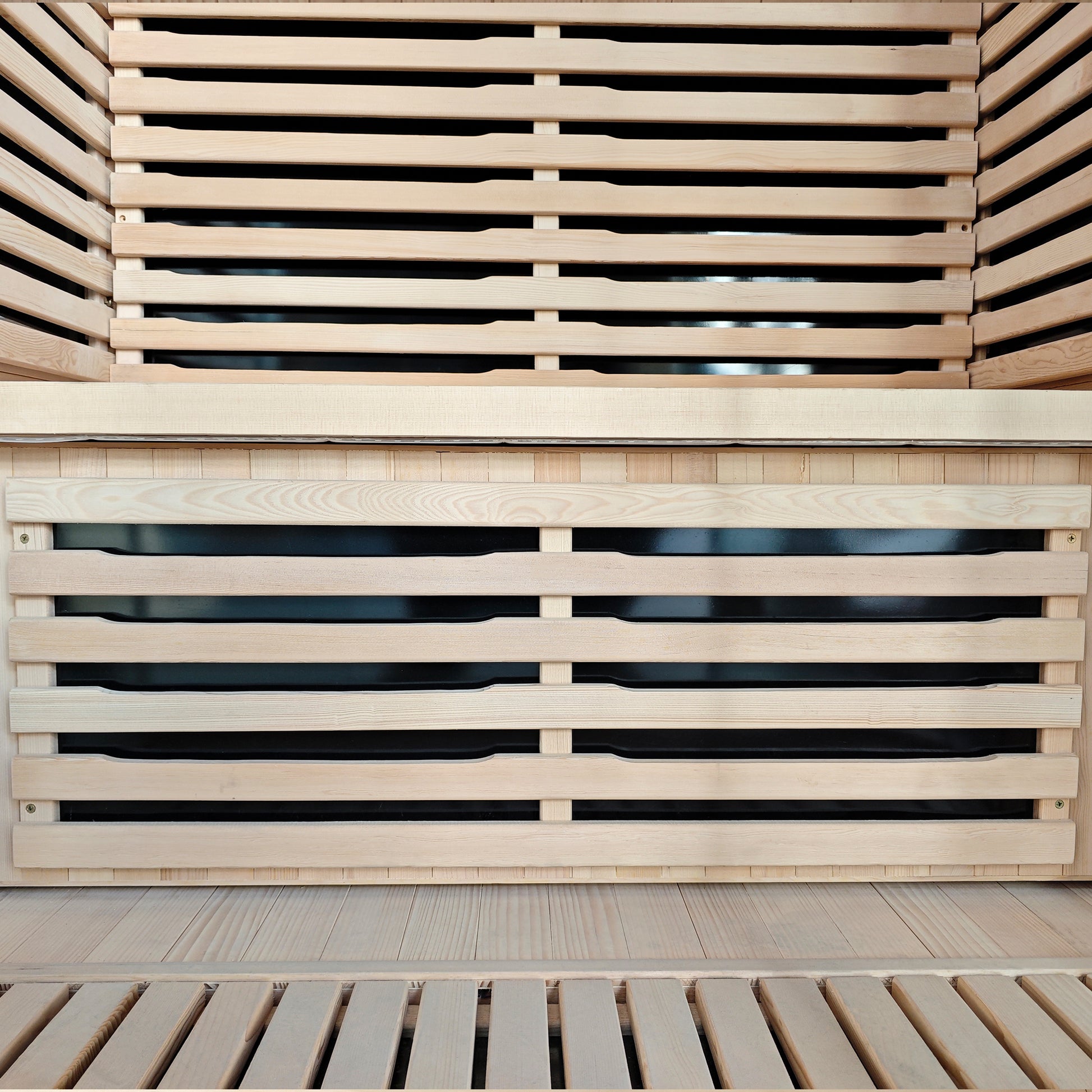 Close-up of wooden sauna bench and slatted interior seating.