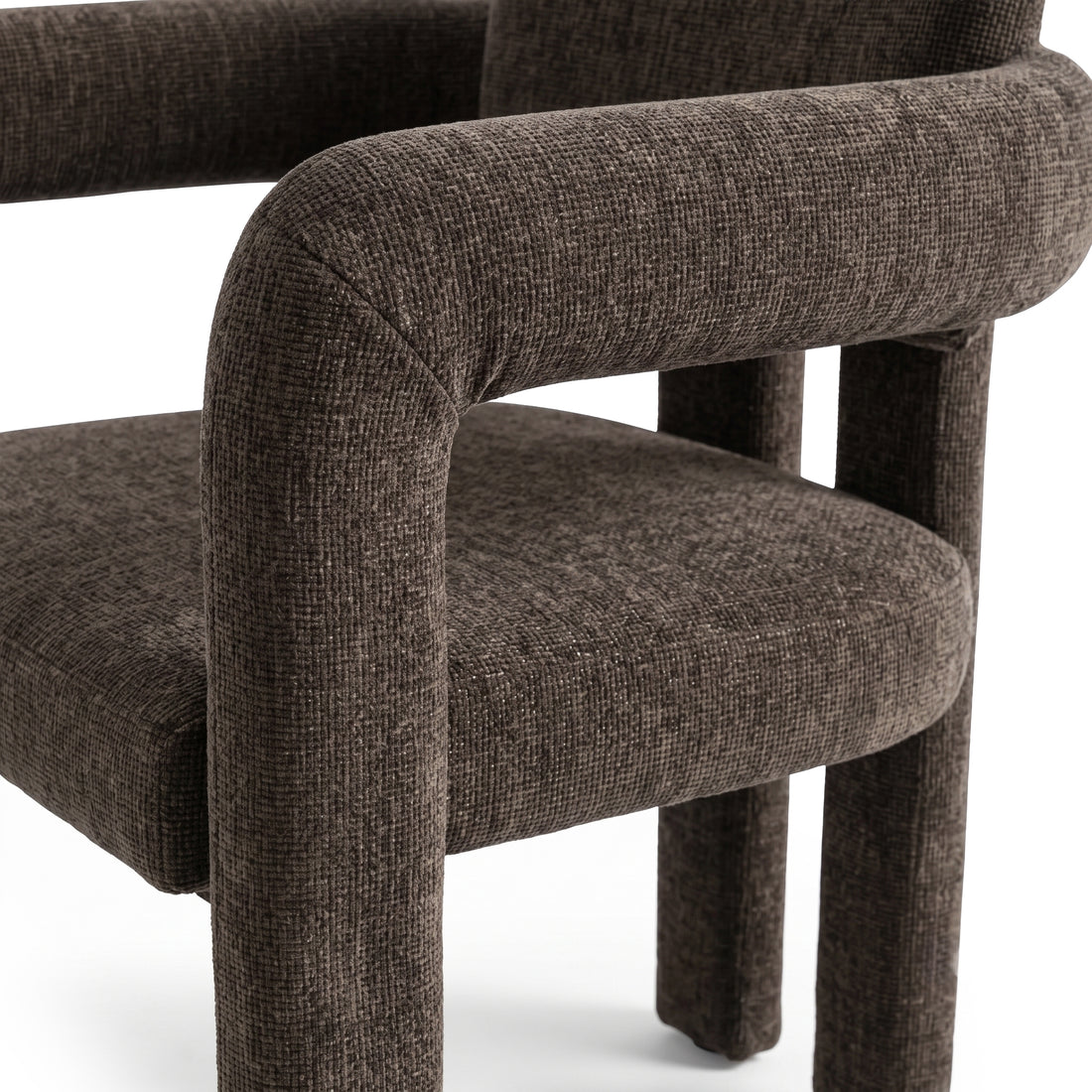 Close-up of the seat and arm of a dark brown upholstered chair on a white background