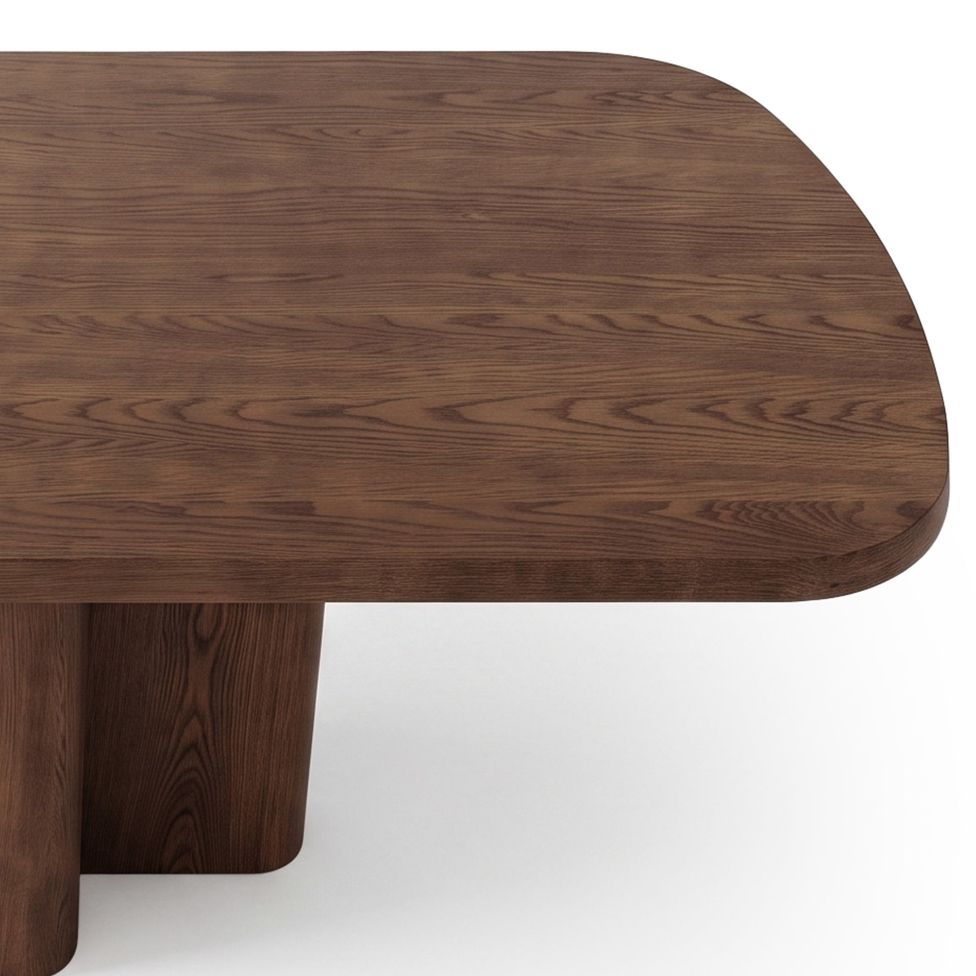 Dark wood rectangular coffee table with rounded corners and cylindrical legs on white background.