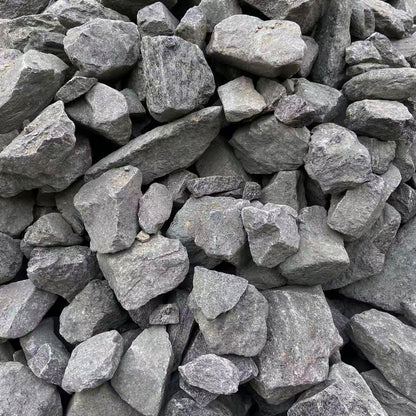 Close-up of rough grey stones showing texture and variation