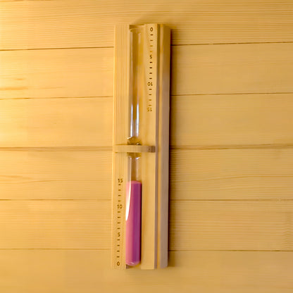 Wooden hourglass timer mounted on a wooden wall with numbered scale markings