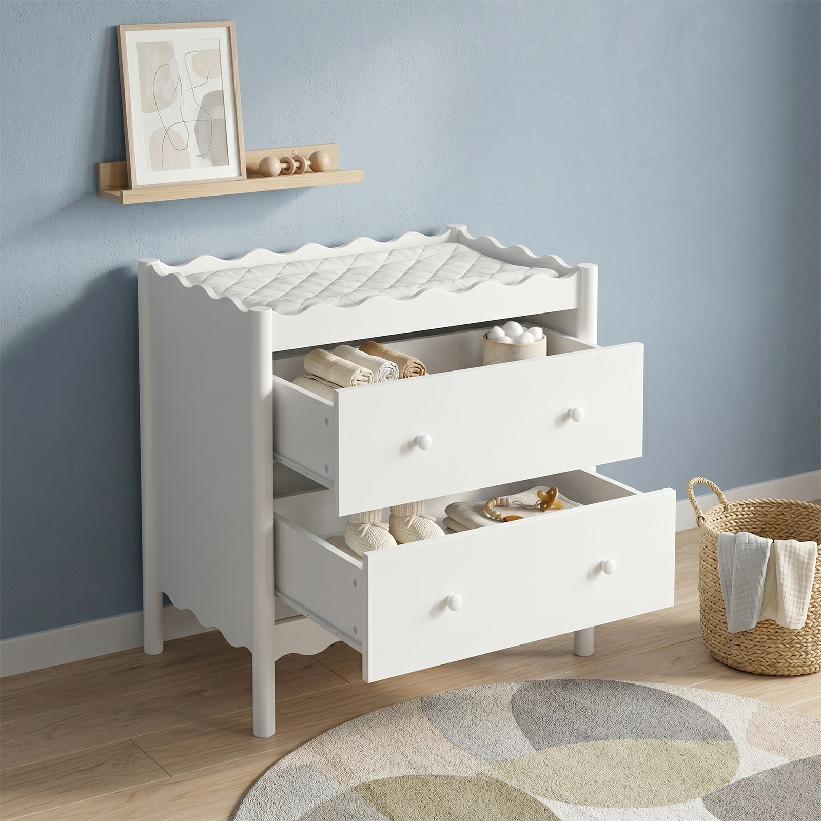 White changing table dresser styled in a nursery with room decor