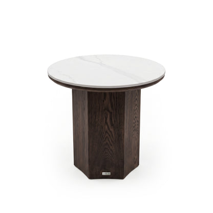Round side table with white marble top and dark wood base on a white background