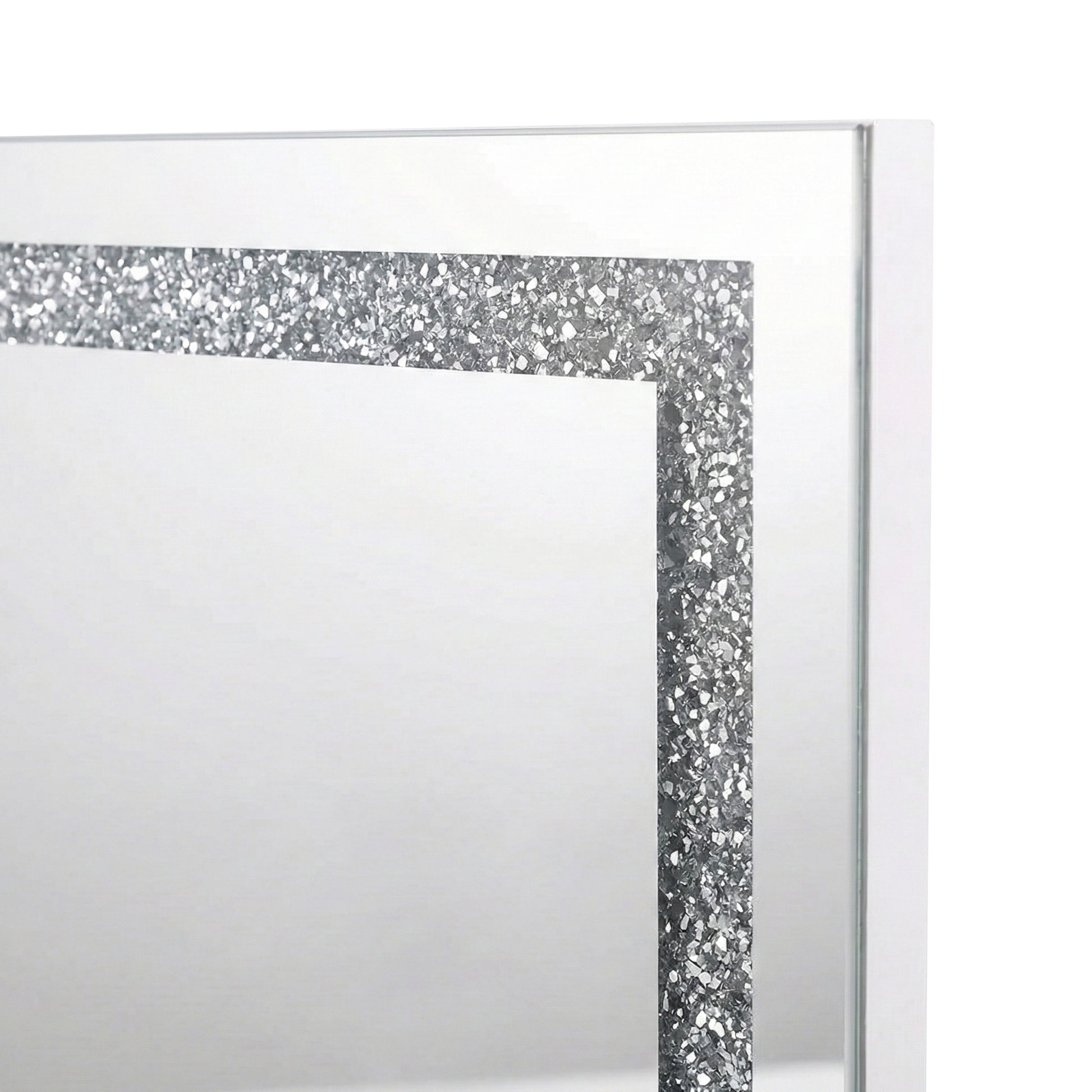Close-up of upper left corner of mirror showing glitter border on white background