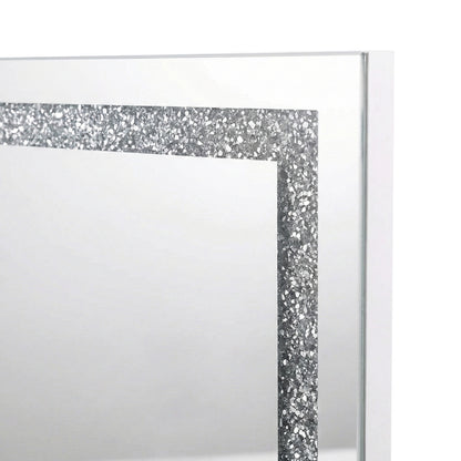 Close-up of upper left corner of mirror showing glitter border on white background