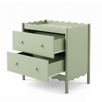 Pastel green dresser or nightstand with scalloped edges and open drawers on a white background