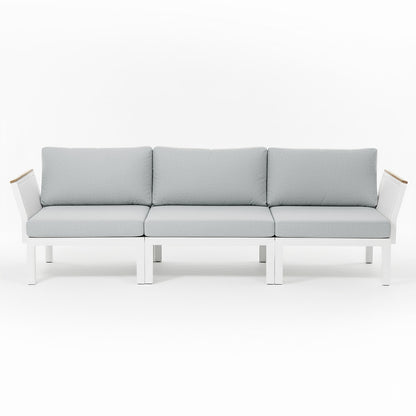 Sierra Outdoor Lounge Set in Grey: Modern three-seat sofa with white metal frame, light gray cushions, angled arms with wood accents, ideal for creating a resort-like ambiance in outdoor spaces.