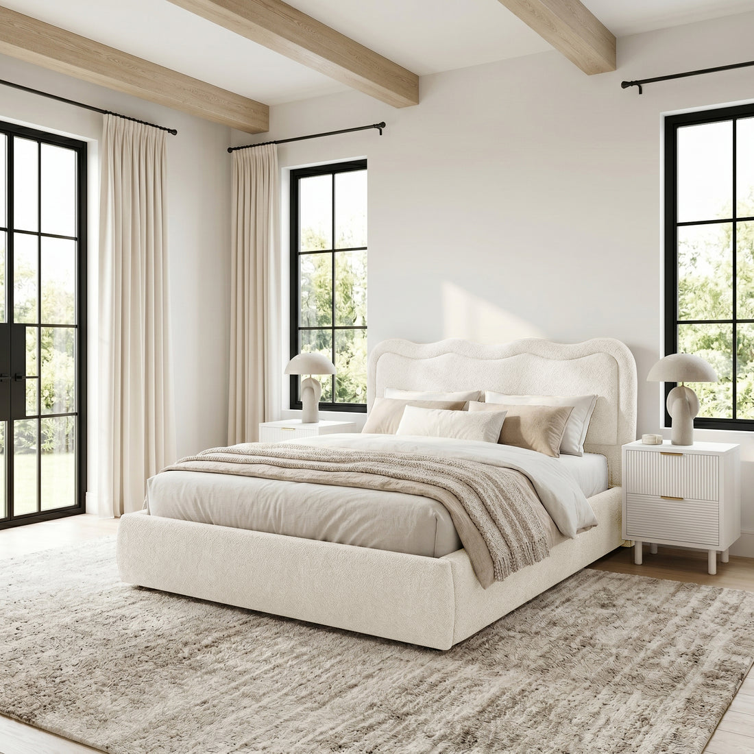 Cream upholstered bed in styled bedroom setting