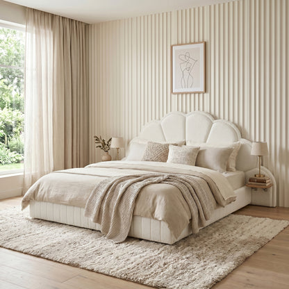 Modern scallop-shaped upholstered bed in styled bedroom