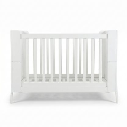 White baby crib centered on white background front view