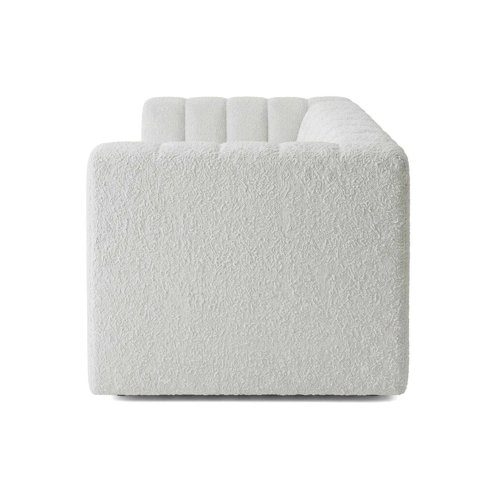 Side profile of a modern white sofa on a white background