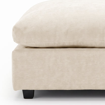 Close-up of beige upholstered furniture corner on a white background