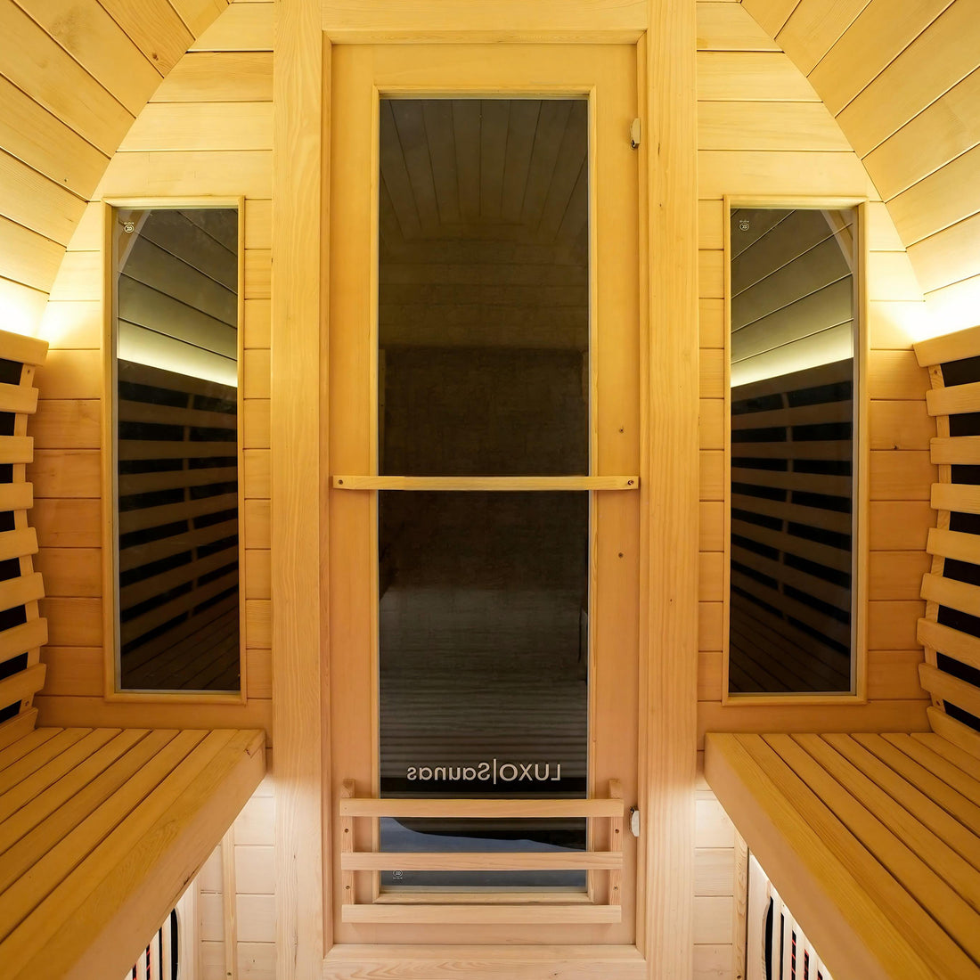Wooden sauna doorway with warm interior lighting and bench seating