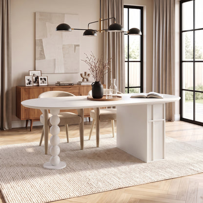 Modern white table in a contemporary dining room with decor and windows
