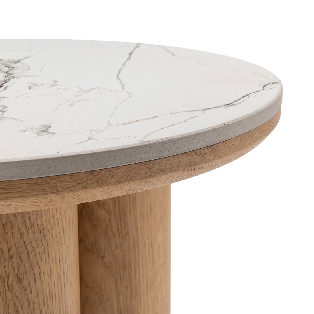 Close-up of a round tabletop with marble-like surface and partial wooden legs on a white background