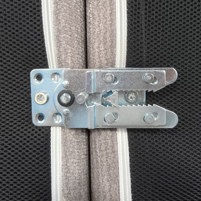 Close-up of metal latch hardware attached to padded fabric panels
