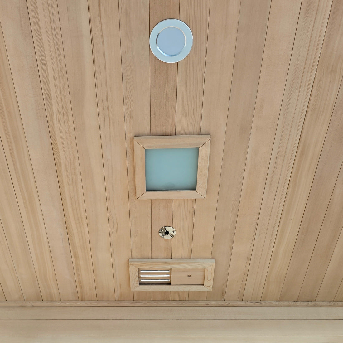 Wood-paneled ceiling with installed fixtures