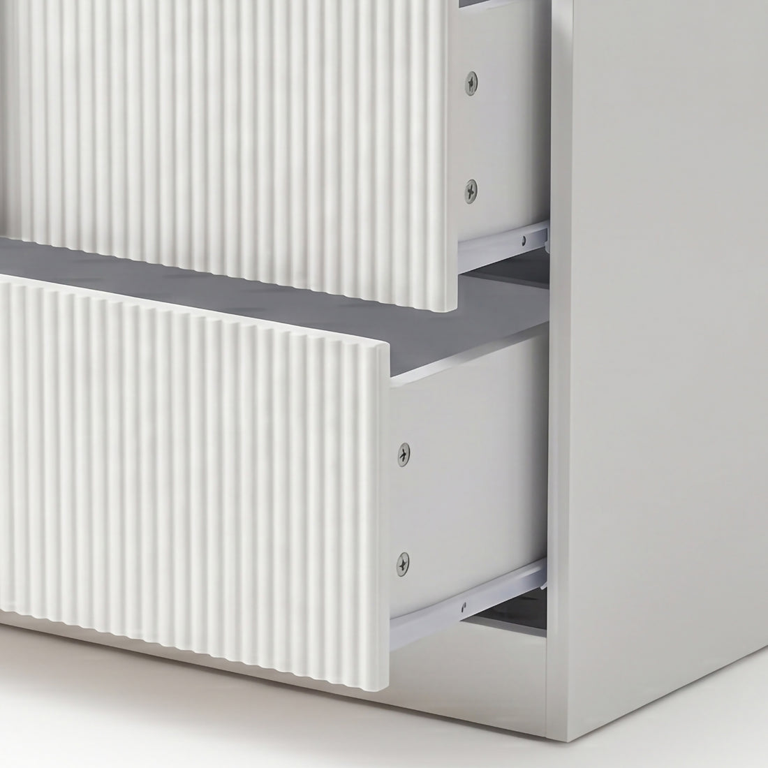 Close-up of two partially open drawers with ribbed fronts