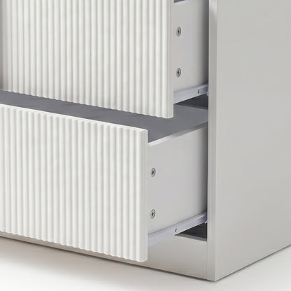 Close-up of two partially open drawers with ribbed fronts