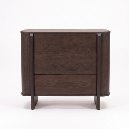 Dark wood three-drawer dresser on a white background