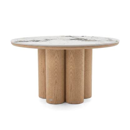 Round table with a light marble top and clustered cylindrical wooden legs on a white background