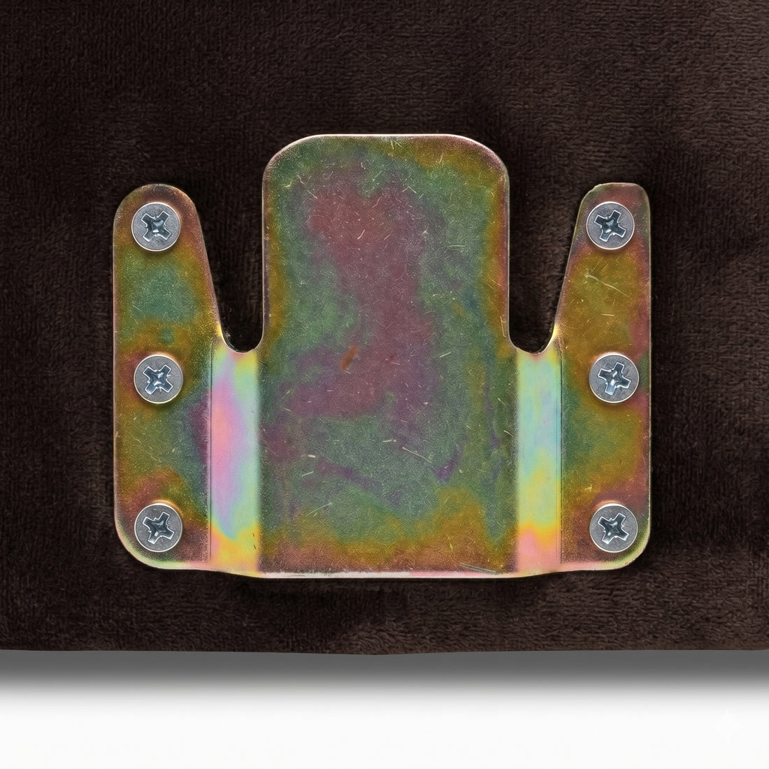 Close-up of metal mounting bracket attached to upholstered surface