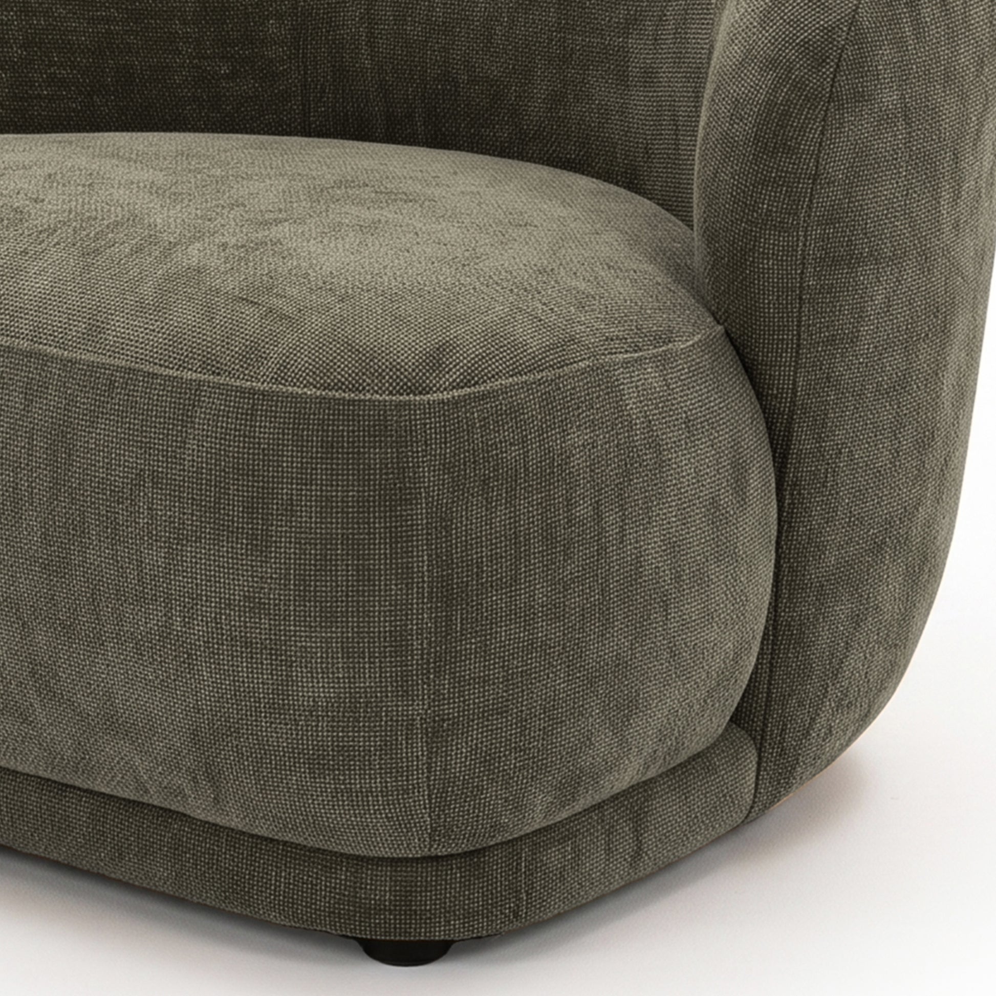 Close-up of the seat and armrest area of an upholstered chair on a white background