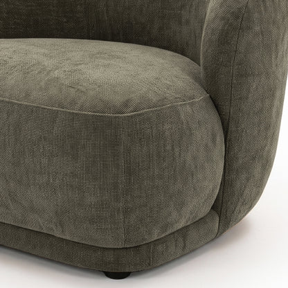 Close-up of the seat and armrest area of an upholstered chair on a white background