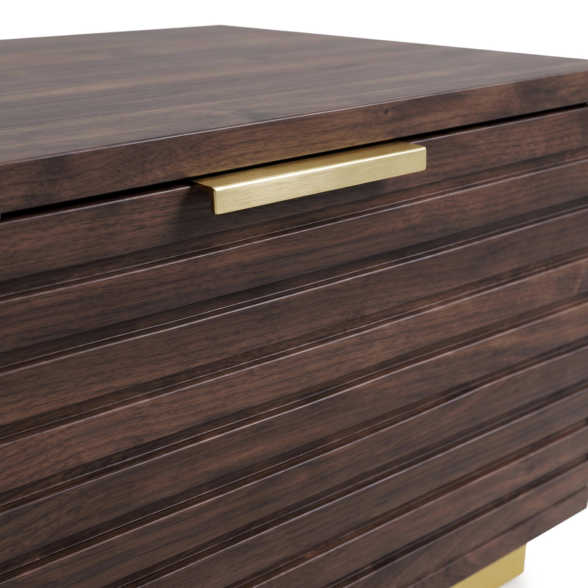 Close-up of the top corner and front detail of a dark wood cabinet