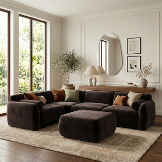 Dark brown sectional sofa with ottoman in styled living room